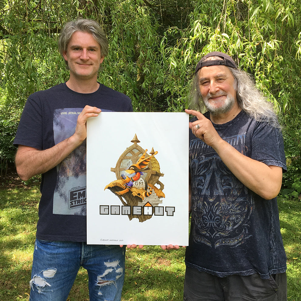 Jon Burton and Rodney Matthews with GameHut logo art